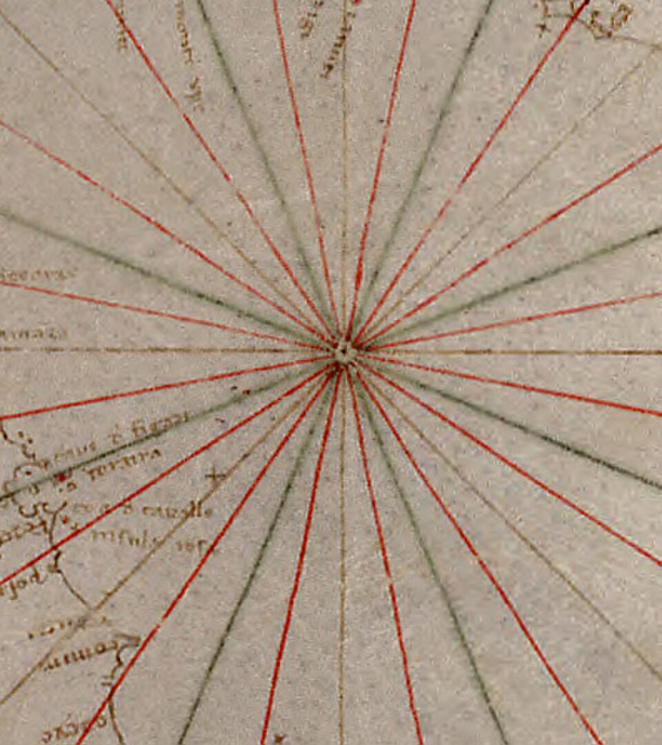 Rose des vents primitive à 32 vents, représentée comme une simple collection de rhumblines codées par couleur, extraite d'une carte nautique génoise (vers 1325)