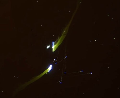 Vaisseaux spatiaux blancs avec une traînée floue sur un écran noir