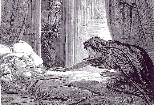 Une personne est allongée dans un lit tandis qu'une autre personne tend la main vers elle sur le lit.