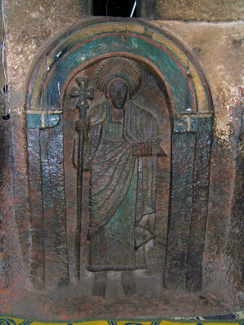 One of the seven life-size saints carved into the wall of the Church of Bet Golgotha, Lalibela, 15th century (traditionally believed to have been made during the reign of Gebre Mesqel Lalibela)