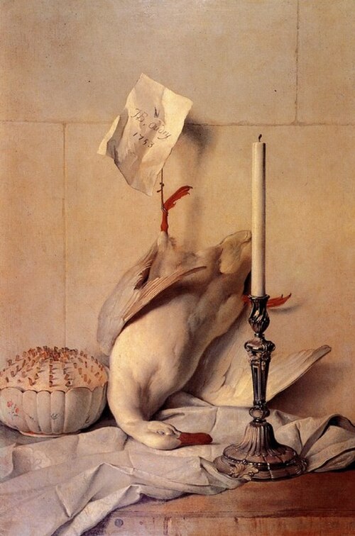 tableau d'un canard plumé accroché dans une cuisine